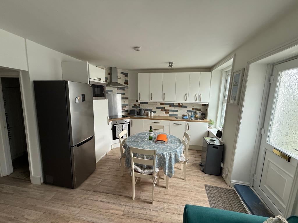 Lot: 155 - FLAT FOR INVESTMENT OR OCCUPATION - open plan kitchen and living room looking towards kitchen